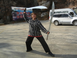 Sensei Bryce in China with a pair of Dragon Swords